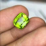 green peridot 7.14 carats cushion cut