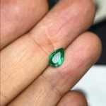 0.75 Ct Certified Panjshir Emerald pear shaped vivid green gemstone.